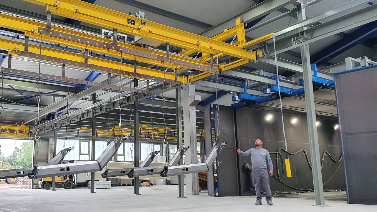 Manual overhead rail systems and crane track systems for transporting large workpieces