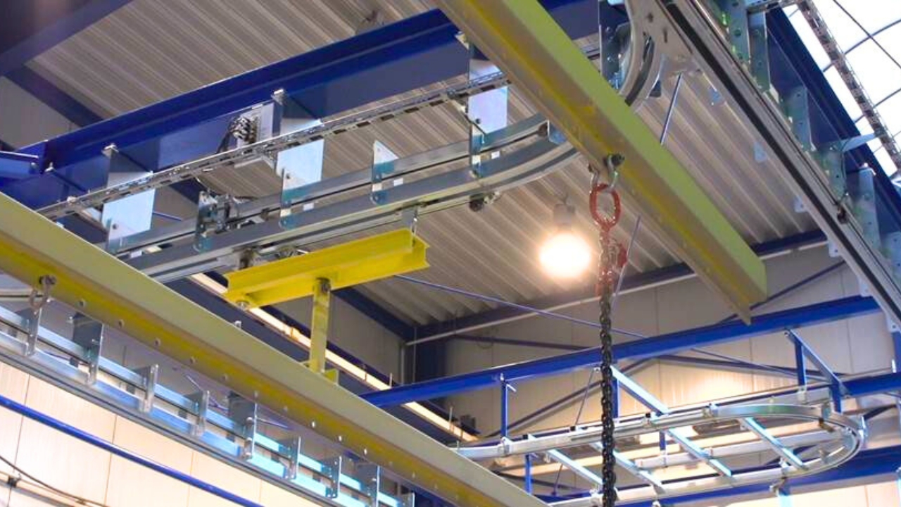 Power & free conveyor systems for automated workpiece handling