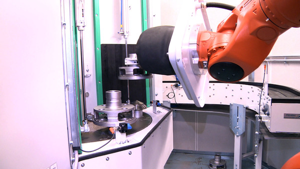 Pressure-blast automated blast machine with workpiece handling via robot