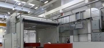 Paint spraying booths with drying function and floor extraction system